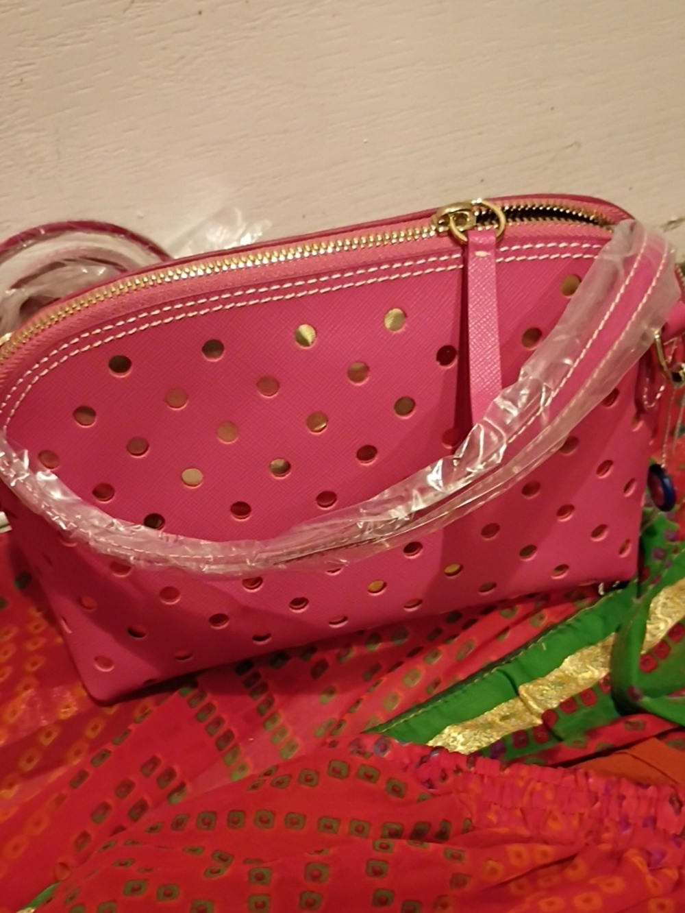 Pink Perforated Crossbody Bag with Gold Accents